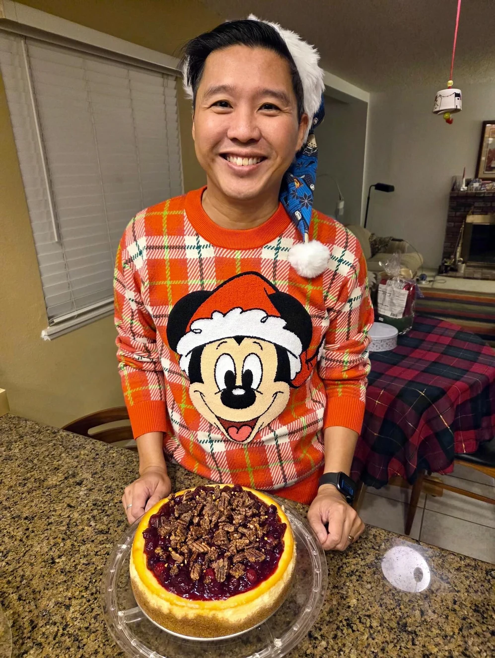 Ray holding one of his homemade cheesecakes