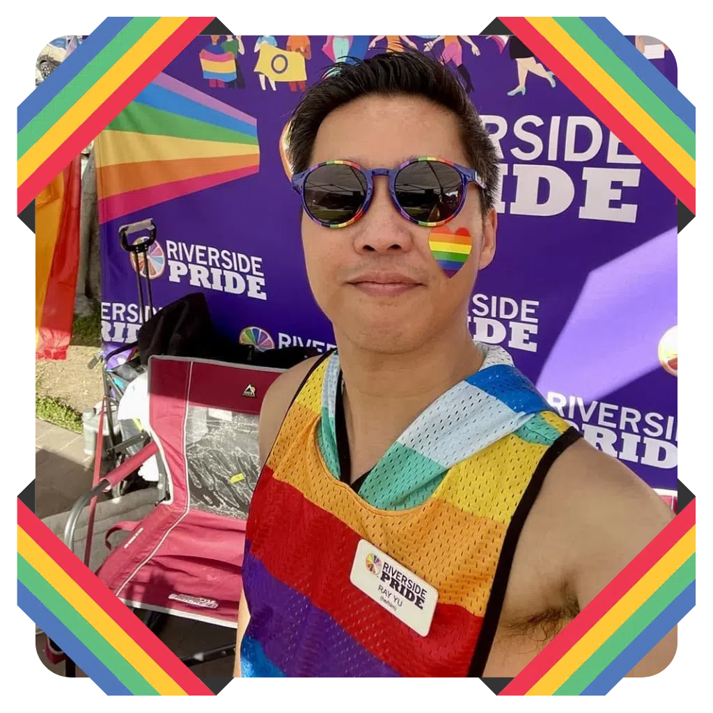 Ray at Riverside Pride in a rainbow-bordered photograph