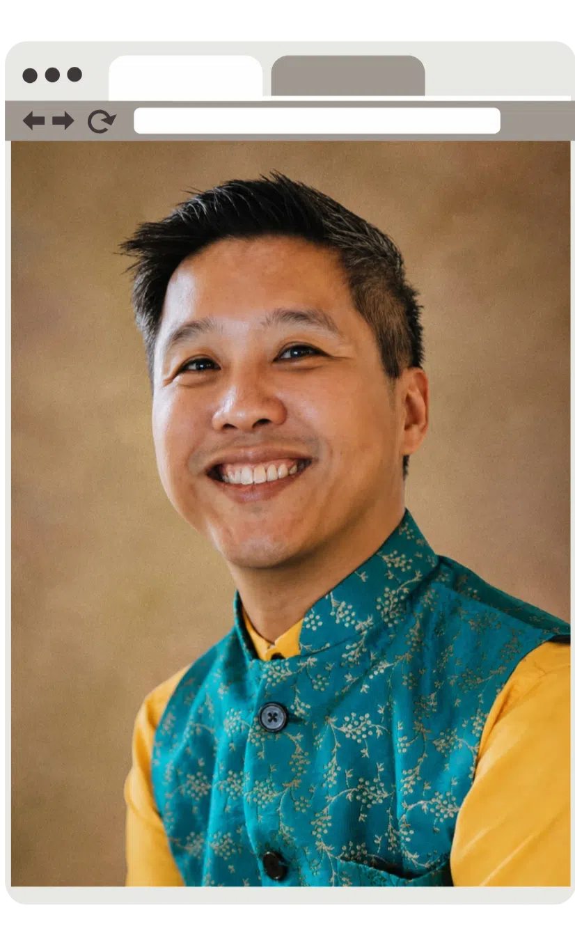 Portrait of Ray in a teal patterned vest, presented inside a browser window